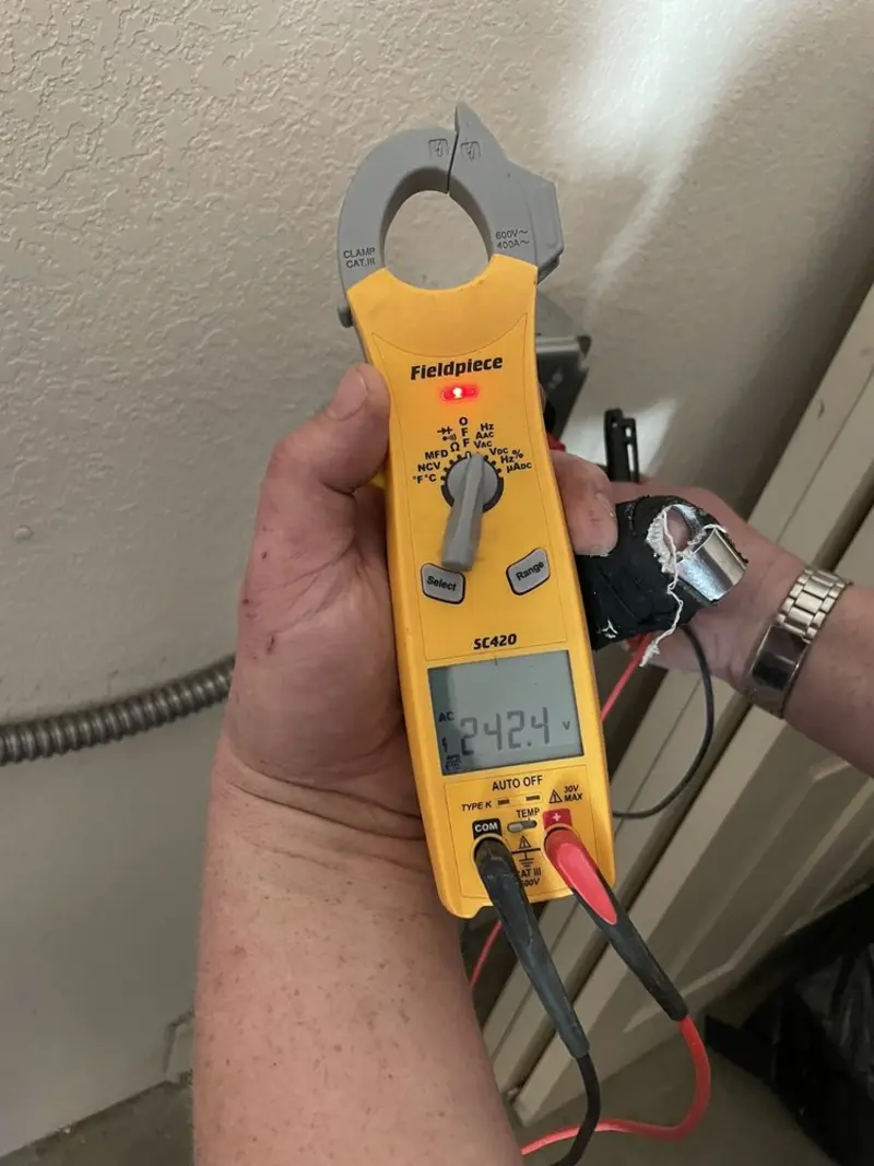 Voltage testing with clamp meter during Ceiling Fan Installation in Chandler